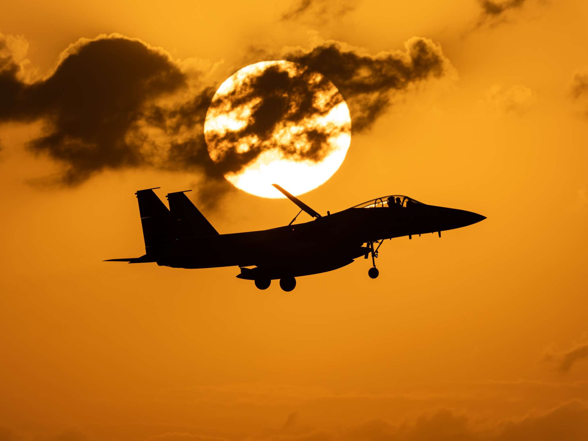 Mitsubishi F-15J Eagle from the 204th Tactical Fighter Squadron landing at Naha Air Base in Okinawa, Japan at sunset